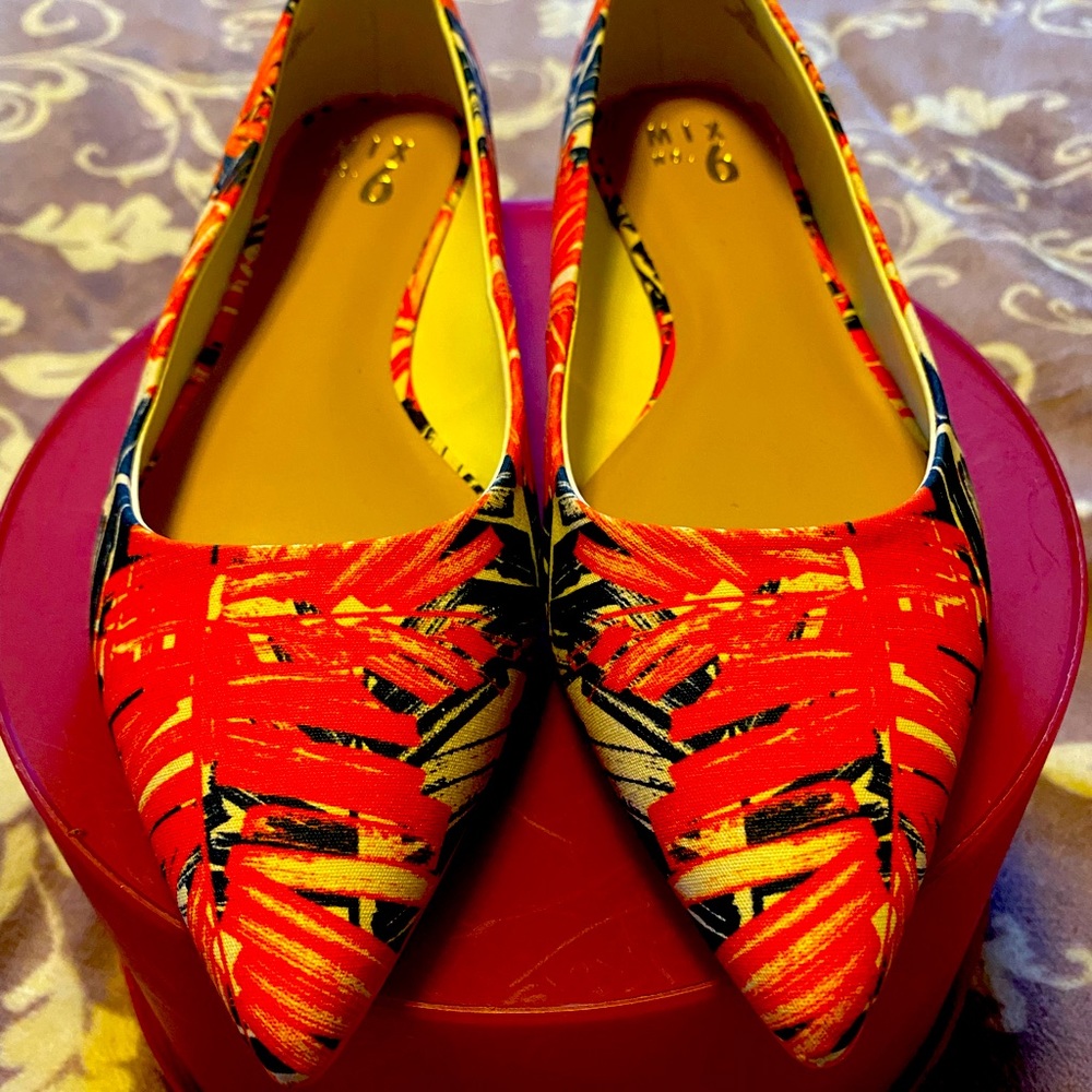 Mix No. 6 orange and blue pointed toe flats.